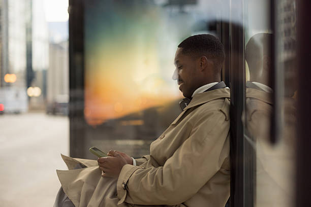 istock Professional Man Waiting at a Station While Using a Smartphone 2210800874