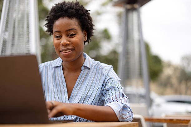 istock Professional Woman Working Remotely on Laptop in Outdoor Setting 2210801004