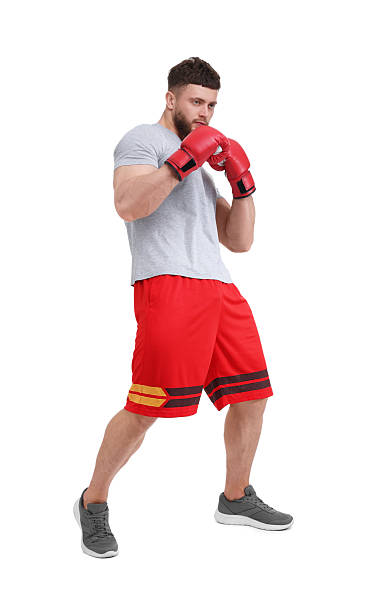 istock Man in boxing gloves fighting on white background 2210803309