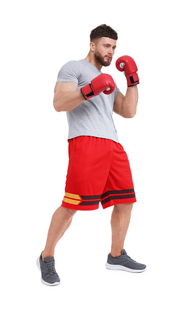 istock Man in boxing gloves fighting on white background 2210803349