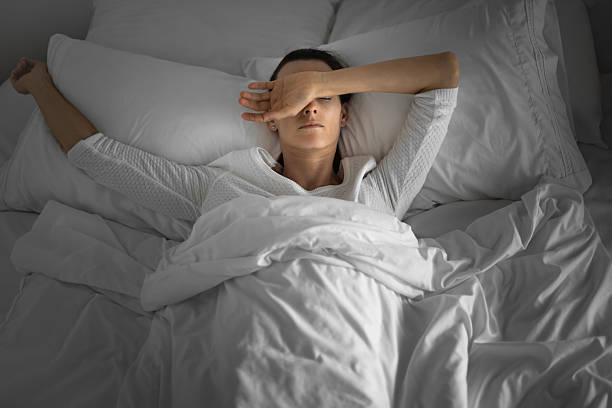 istock Woman suffering from sleep apnea. 2210803772