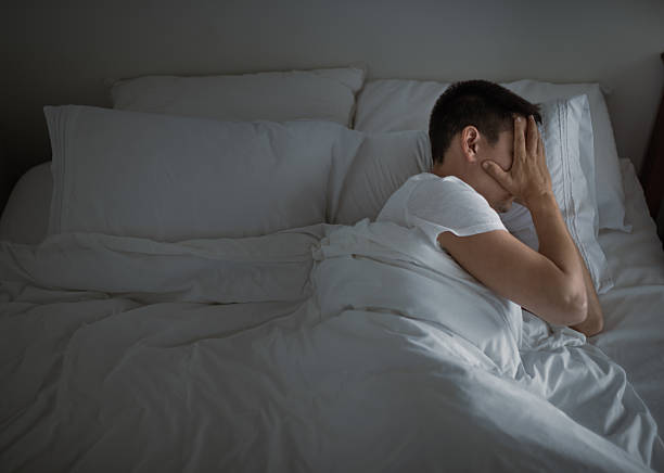 istock Lonely man lying in bed feeling lonely. Insomnia. Divorce. Broken heart. 2210803819