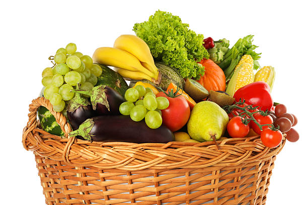 istock Different fresh fruits and vegetables in wicker basket isolated on white 2210803915