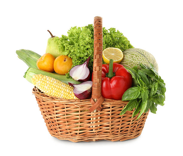 istock Different fresh fruits and vegetables in wicker basket isolated on white 2210803983