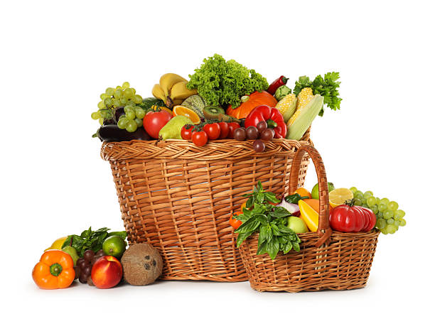 istock Different fresh fruits and vegetables in wicker baskets isolated on white 2210803992