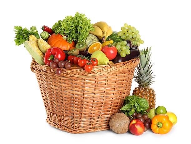 istock Different fresh fruits and vegetables in wicker basket isolated on white 2210804002
