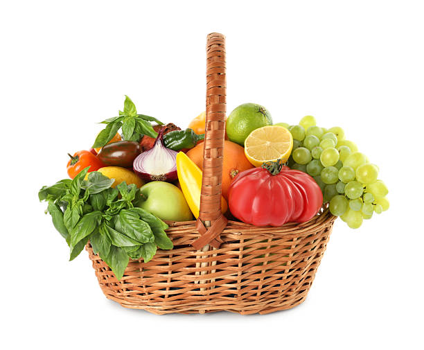 istock Different fresh fruits and vegetables in wicker basket isolated on white 2210804003