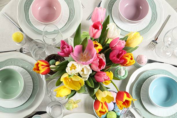 istock Festive Easter table setting with beautiful flowers and painted eggs, top view 2210804907