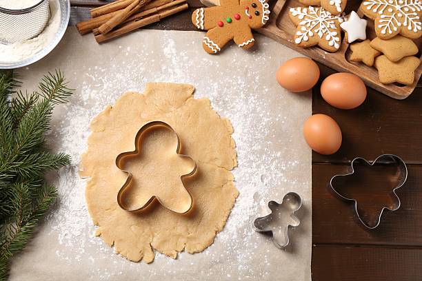 istock Making Christmas cookies. Flat lay composition with ingredients and raw dough on wooden table 2210804942