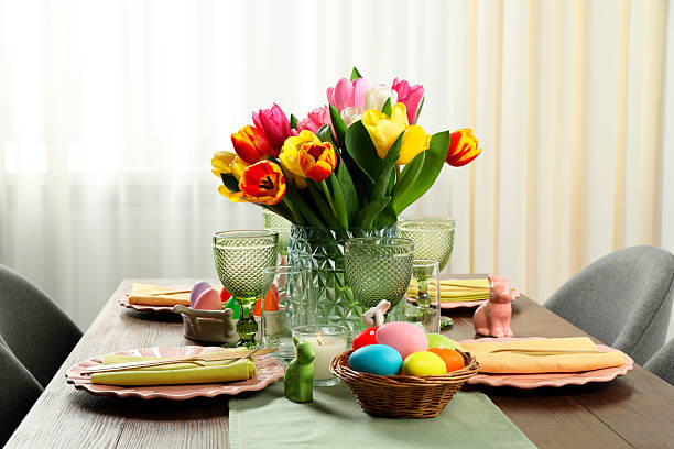 istock Easter celebration. Festive table setting with beautiful flowers and painted eggs 2210804977