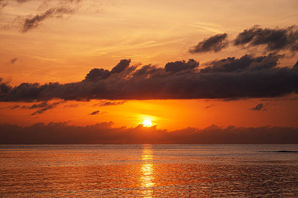 istock Twilight background of sunset over the tropical ocean 2210807778