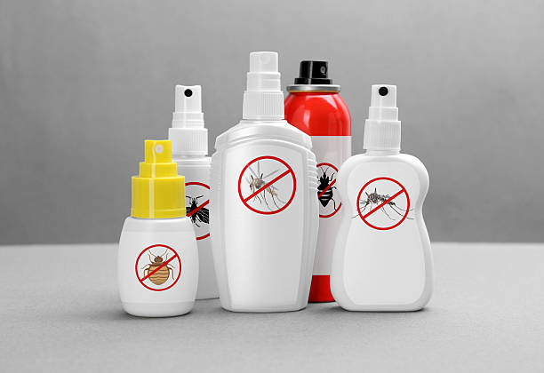 istock Different insect repellents in spray bottles on grey background 2210809117