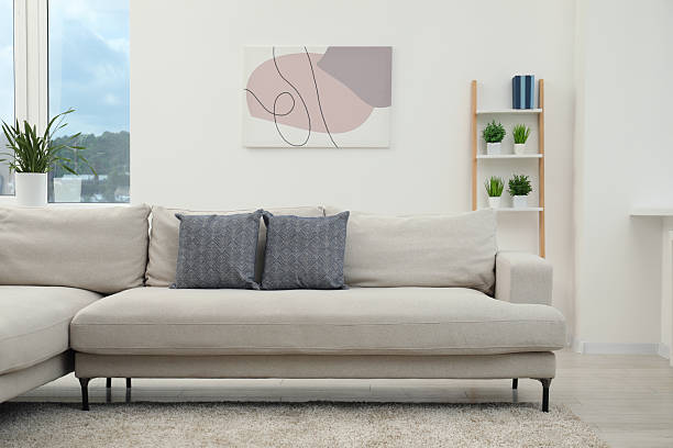 istock Stylish room interior with comfortable sofa and houseplants 2210809176
