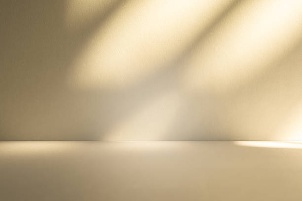 istock Studio style background wall decoration presentation uses white and beige tones. with shadows cast from a nearby window, concept creating a decorative 2210819655