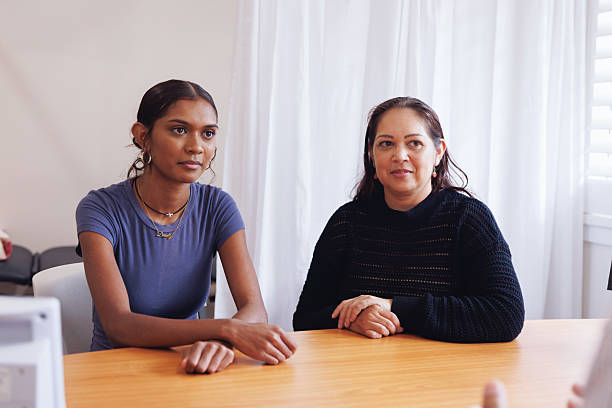 istock Aboriginal mother and daughter in doctors surgery 2210822608
