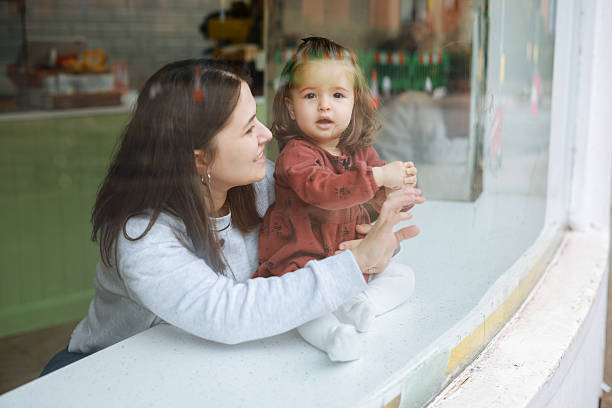 istock Smiling young mother and baby daughter 2210824175