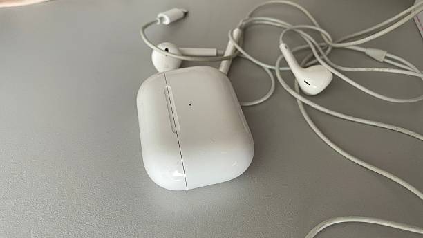 istock Wireless computer earphones on the table, stock photo 2210825635
