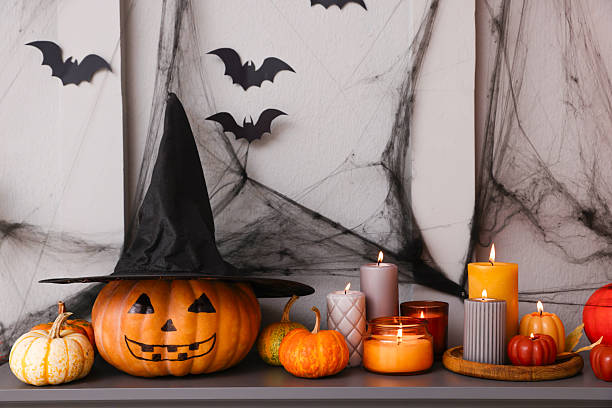 istock Fireplace with different Halloween decor indoors. Festive interior 2210828951