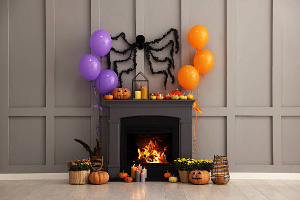 istock Room with fireplace decorated for Halloween. Festive interior 2210829043