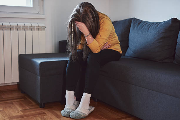 istock Woman with strong stomach ache, menstrual and digestive issues at home. 2210834992