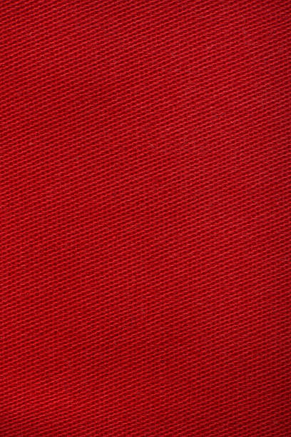 istock Red denim jeans texture close up. Red denim jeans background. 2210836381