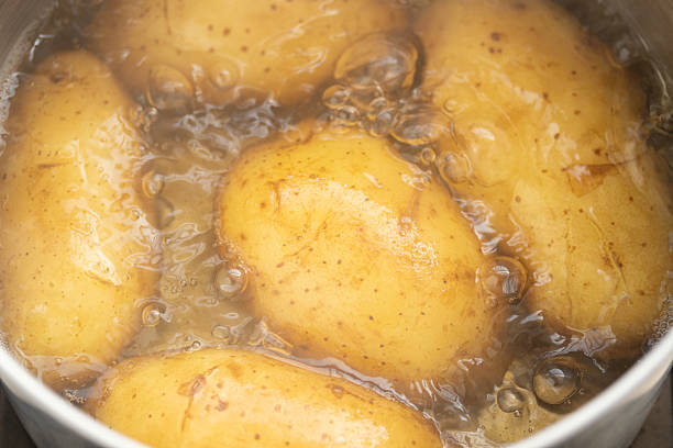 istock Potato boiling in hot water, Close-up 2210839542