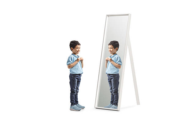 istock Boy in front of a mirror 2210840015