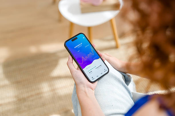 istock Woman using a finance app on her smartphone 2210842050