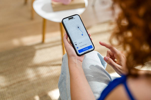 istock Woman using ride sharing app on smartphone 2210842099