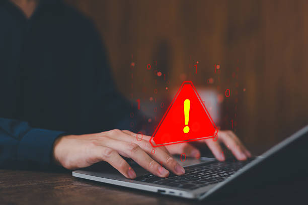 istock System hacked warning alert on laptop. error 404 alerts on a laptop, caution of spam in website digital Cyber attack on computer network, Virus, Spyware, Malware or Malicious software. Cyber security 2210842702