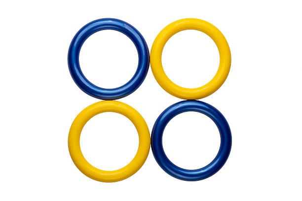 Colorful Plastic Rings in Blue and Yellow on White Background.