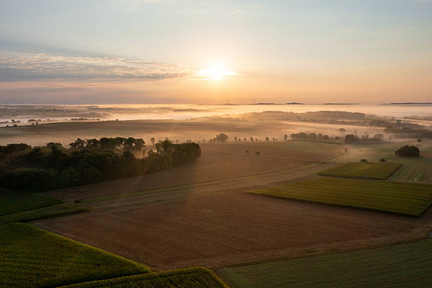 istock Drone image at sunrise with rolling landscapes covered in fog 2210851242