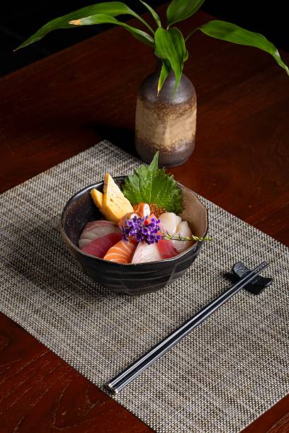 Savoring fresh sashimi platter japanese restaurant culinary delight indoor dining close-up view vibrant flavors and presentation