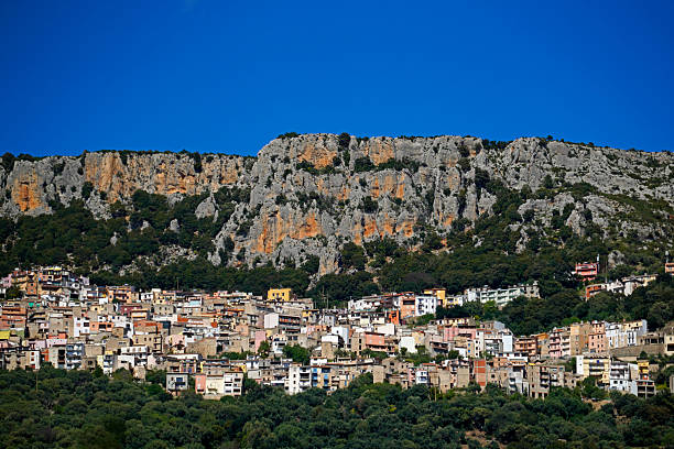 Baunei is not far from the east coast. The houses are grouped on several levels below a rock face. The mountain village is an ideal starting point for hikes up to a secluded limestone plateau