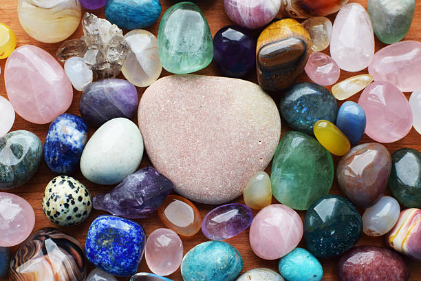 istock Gemstone background with space for text, healing crystals. Labradorite, amethyst, fluorite, lapis lazuli, agates, rose quartz. 2210862595