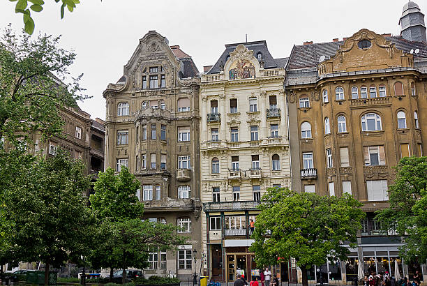 Budapest Hungary - May 2:   old houses on Fovam Square in Budapest. The architecture of old Europe May 2 2024 in Budapest Hungary
