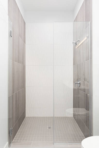 istock A white and brown tiled walk-in shower. 2210864151