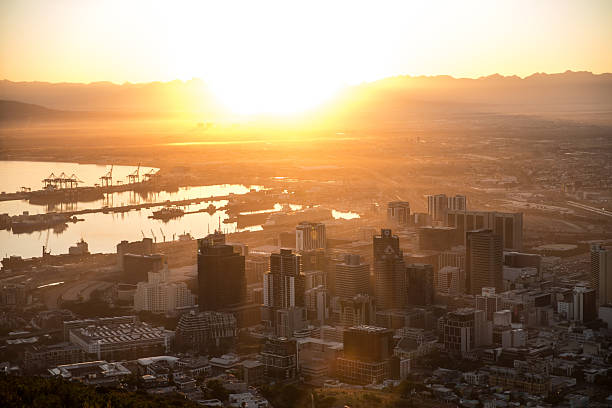 First morning sun rays illuminating Cape Town city center