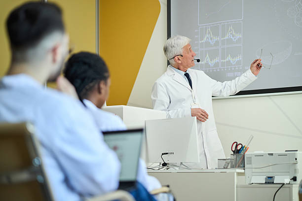 istock Senior Scientist Giving Lecture in Modern Classroom 2210864990