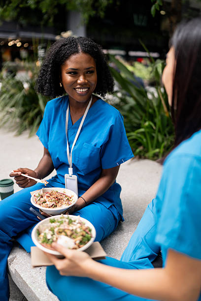 istock Female Healthcare Workers Enjoy Lunch Break 2210867933