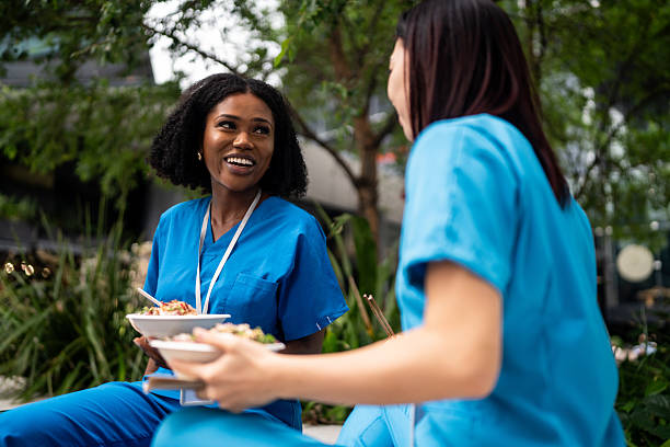 istock Nurses Bonding Over Lunch Outdoors in Sydney 2210868165
