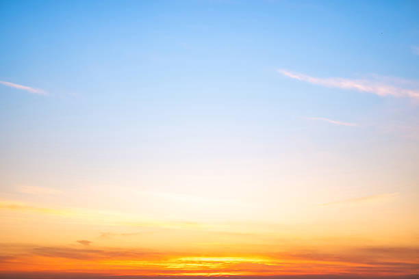 istock Beautiful , luxury soft gradient orange gold clouds and sunlight on the blue sky perfect for the background, take in evening,Twilight, Large size, high definition landscape photo 2210869348