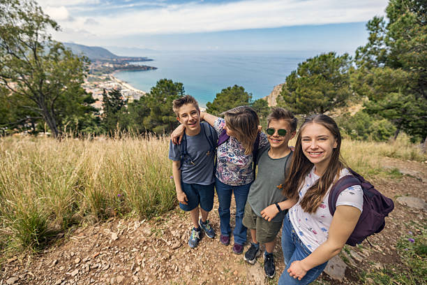 istock Family hiking adventure with a stunning coastal backdrop. 2210872949