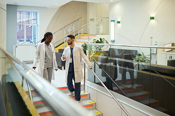 istock Discussing Medical Procedures While Walking in Hospital 2210873351