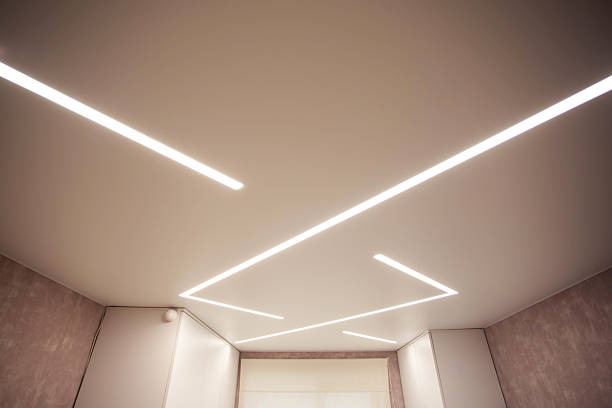 istock Modern designer stretch ceiling with illuminated LED lines in the room, backlighting 2210876429