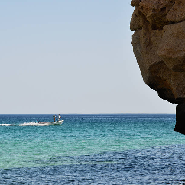 istock Oman. Fishermans on a boat 2210880018