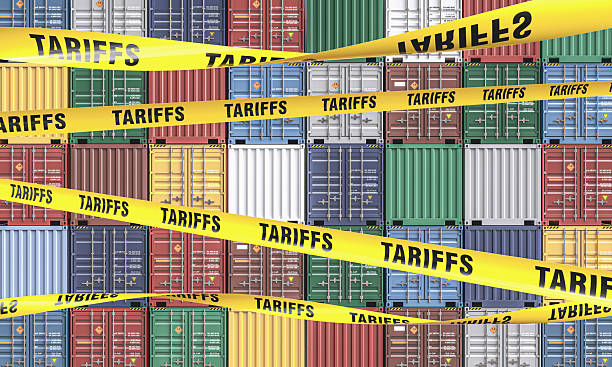istock Tariffs barrier tapes blocking international trade and shipping containers 2210881668