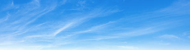 istock clear blue sky with clouds. very bright and the sun is shining 2210884051