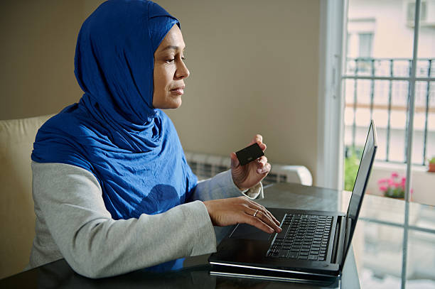 istock Woman Making an Online Purchase in a Comfortable Home Office Setting 2210884358
