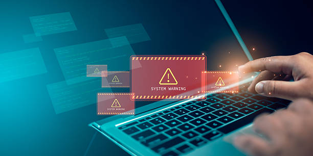 istock System warning hacked alert, Cyber attack on network, Virus and Cyber Security, Huaman receive notifications from the system fraud alert, Laptop shows warning sign of system failure, Notification spam 2210885353